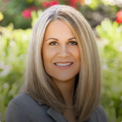 HOA attorney / HOA law A woman with blonde hair and a professional smile, specializing in HOA attorney and law