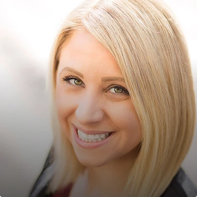 HOA attorney / HOA law A woman with blonde hair and a friendly smile