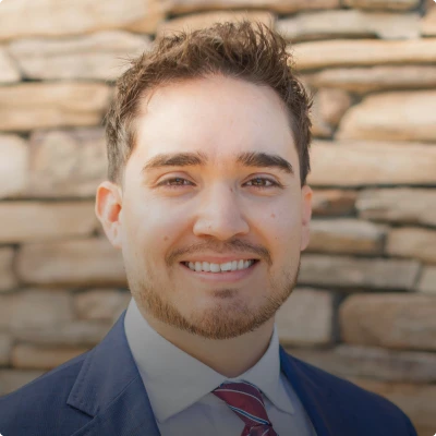 HOA attorney / HOA law A man in a suit and tie smiling at the camera